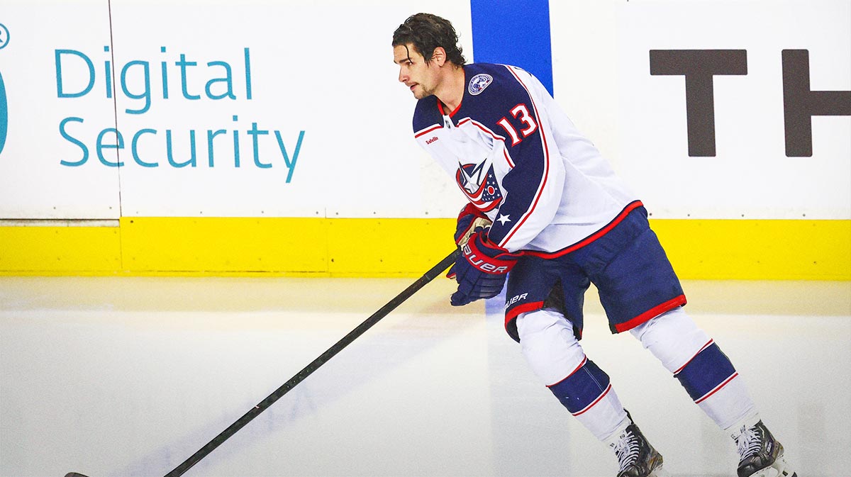 Columbus Blue Jackets center Sean Monahan (23) skates with the puck wearing late Johnny Gaudreau jersey number during the warmup period against the Calgary Flames at Scotiabank Saddledome.