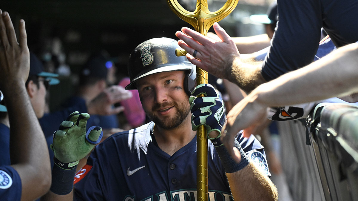 Seattle Mariners catcher Cal Raleigh (29) celebrates in the dugout after hitting a two run home run against the Chicago Cubs during the seventh inning at Wrigley Field. Bench
