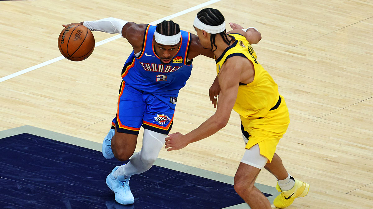 Oklahoma City Thunder guard Shai Gilgeous-Alexander (2) drives to the basket against Indiana Pacers guard Andrew Nembhard (2) during the fourth quarter in game three of the 2025 NBA Finals at Gainbridge Fieldhouse.