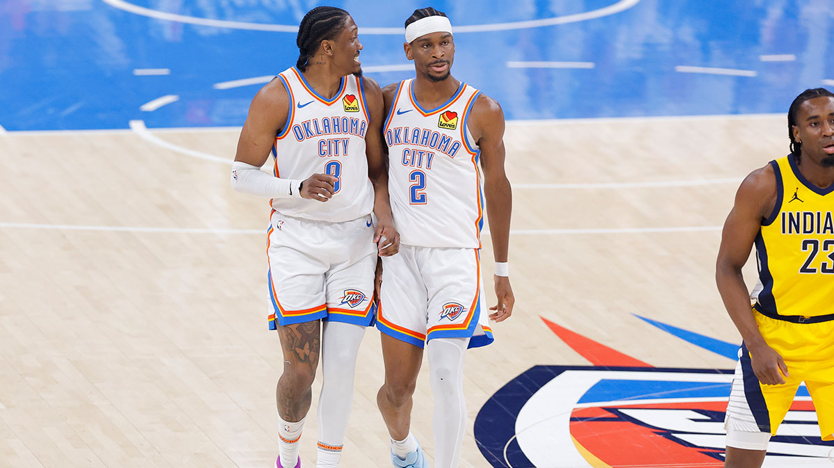 Oklahoma City Thunder forward Jalen Williams (8) and guard Shai Gilgeous-Alexander (2) walk back up the court in the first quarter against the Indiana Pacers during game five of the 2025 NBA Finals at Paycom Center.