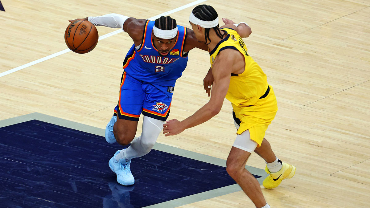 Thunder guard Shai Gilgeous-Alexander (2) drives to the basket against Indiana Pacers guard Andrew Nembhard (2) during the fourth quarter in game three of the 2025 NBA Finals at Gainbridge Fieldhouse