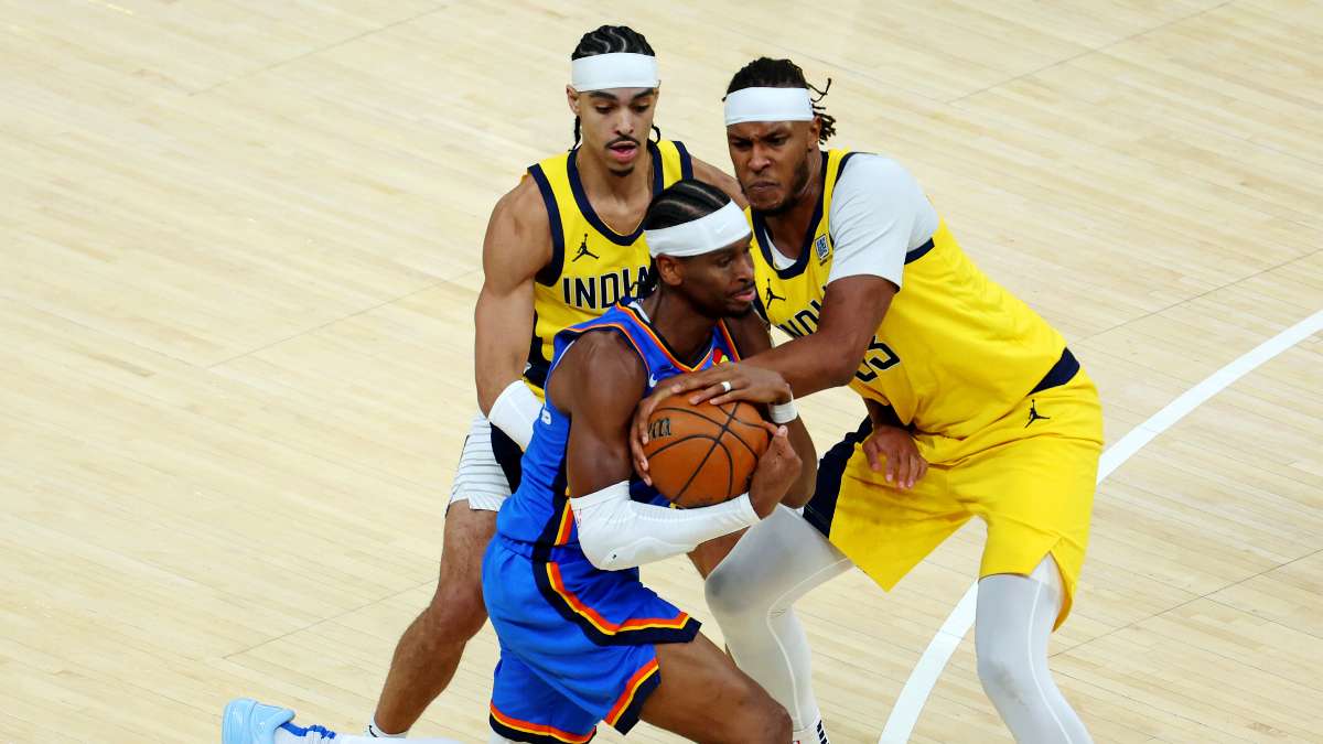 Oklahoma City Thunder guard Shai Gilgeous-Alexander (2) drives to the basket against Indiana Pacers center Myles Turner (33) and guard Andrew Nembhard (2) during the third quarter in game three of the 2025 NBA Finals at Gainbridge Fieldhouse.