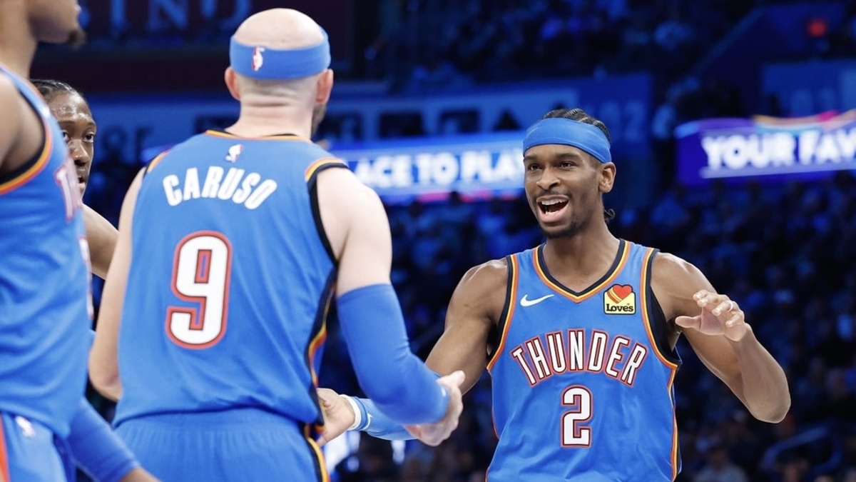 Oklahoma City Thunder guard Shai Gilgeous-Alexander (2) celebrates with guard Alex Caruso (9) after a basket against the Dallas Mavericks during the second half at Paycom Center.
