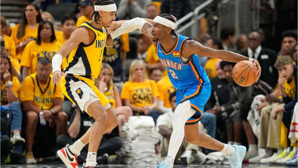 Oklahoma City Thunder guard Shai Gilgeous-Alexander (2) dribbles the ball defended by Indiana Pacers guard Andrew Nembhard (2) in the third quarter during game six of the 2025 NBA Finals at Gainbridge Fieldhouse. 