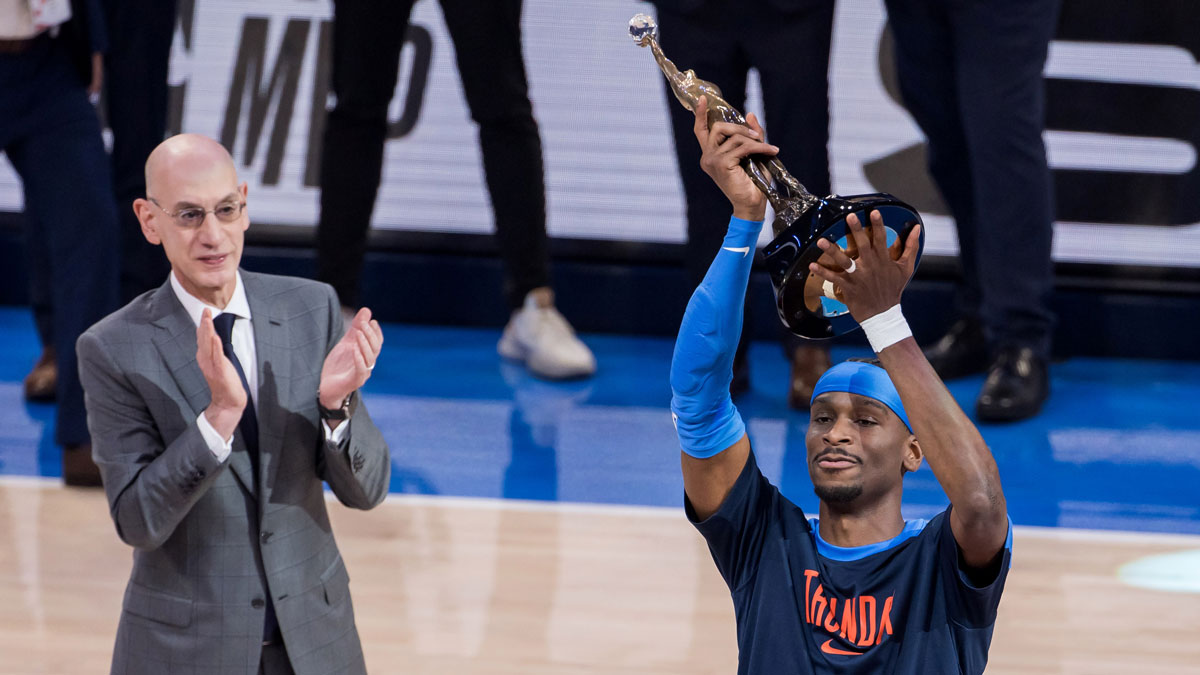 NBA commissioner is Adam Silver presents Oklahoma City Thunder guard Shai Gilgeous-Alexander (2) with the Michael Jordan Trophy for winning the most valuable player award for the 2024-25 season before game two of the western conference finals for the 2025 NBA Playoffs at Paycom Center.