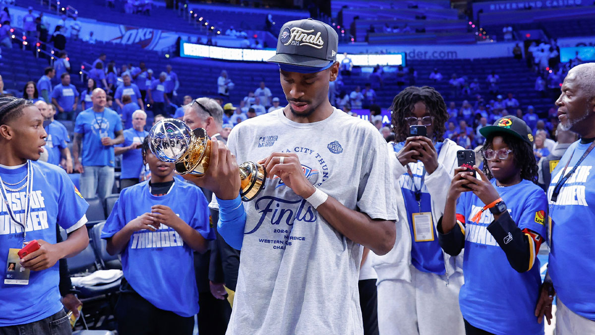 Oklahoma City Thunder guard Shai Gilgeous-Alexander (2) looks at his western conference finals MVP trophy after his team defeated the Minnesota Timberwolves in the western conference finals at Paycom Center.