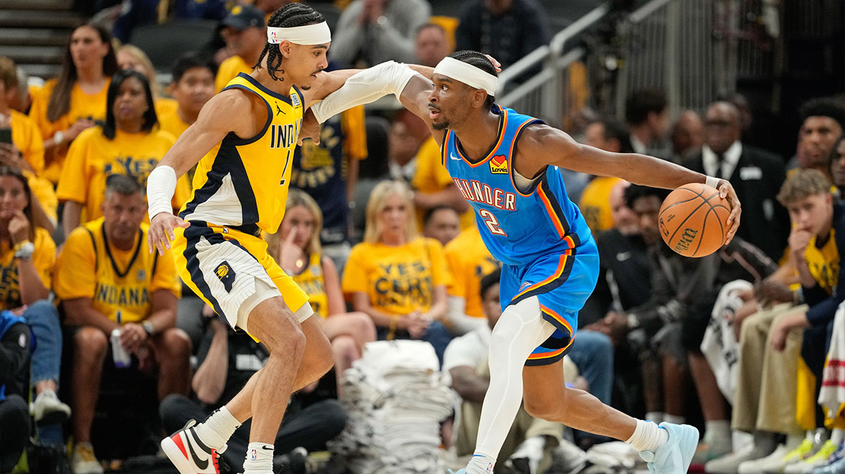 Oklahoma City Thunder guard Shai Gilgeous-Alexander (2) dribbles the ball defended by Indiana Pacers guard Andrew Nembhard (2) in the third quarter during game six of the 2025 NBA Finals at Gainbridge Fieldhouse.
