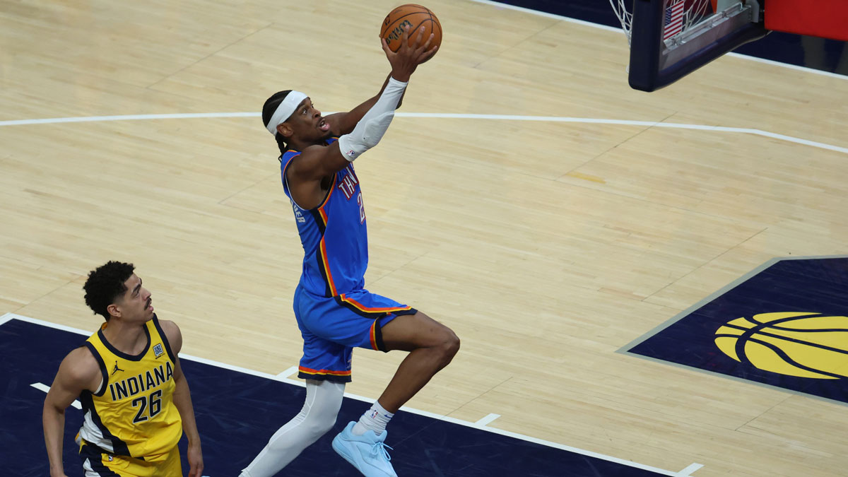 Oklahoma City Thunder guard Shai Gilgeous-Alexander (2) dunks past Indiana Pacers guard Ben Sheppard (26) during the third quarter against the Indiana Pacers during game four of the 2025 NBA Finals at Gainbridge Fieldhouse.