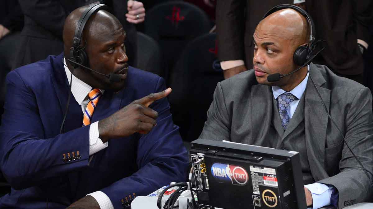 TNT broadcaster Shaquille O'Neal (left) and Charles Barkley talk during the 2013 NBA All-Star slam dunk contest at the Toyota Center.