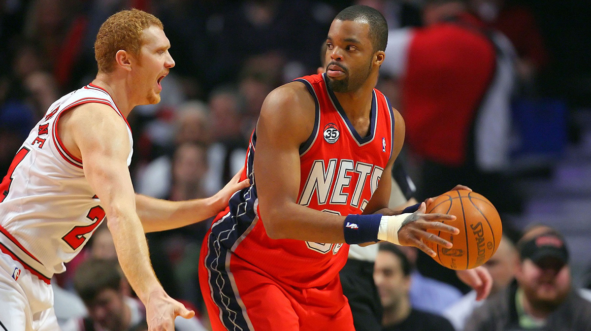 New Jersey Nets power forward Shelden Williams (33) is defended by Chicago Bulls power forward Brian Scalabrine (24) during the first half at the United Center.