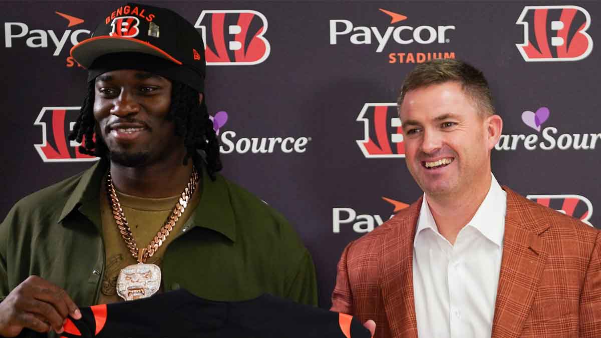 Cincinnati Bengals first-round draft pick Shemar Stewart, left, and head coach Zac Taylor, right, pose together ahead of a press conference.