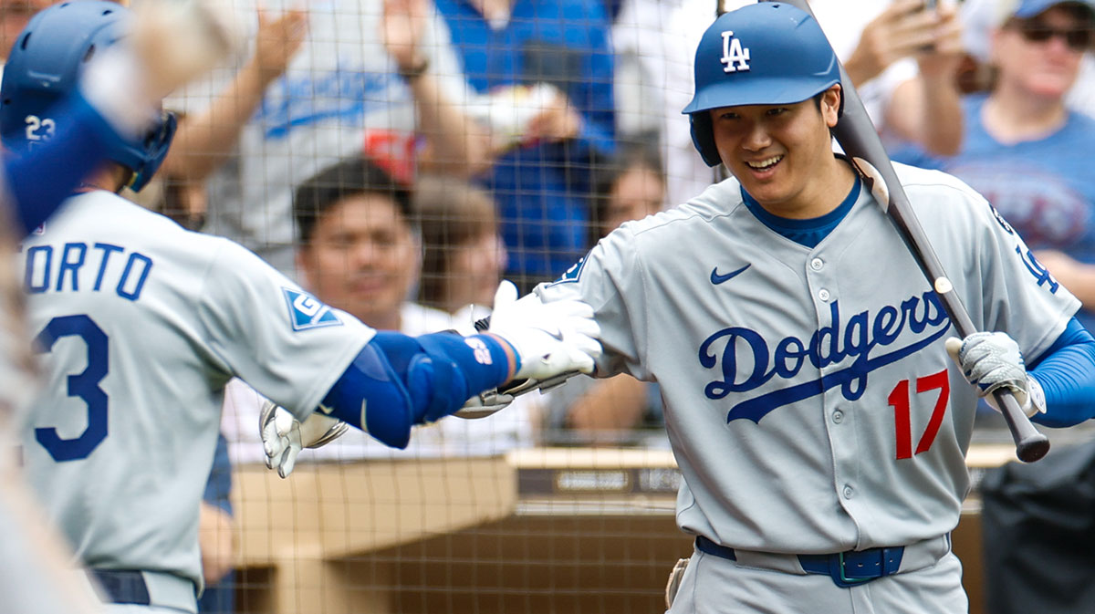 Los Angeles Dodgers left fielder Michael Conforto (23) celebrates with designated hitter Shohei Ohtani (17) after hitting a one run home run during the fifth inning against the San Diego Padres at Petco Park.