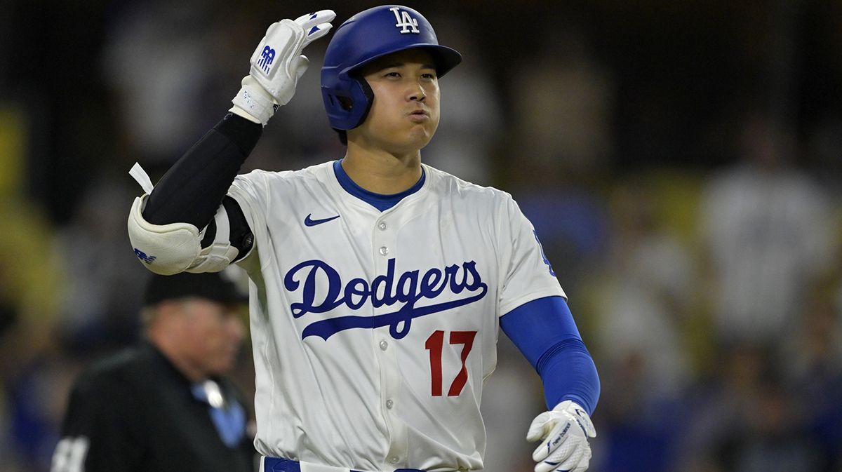 Los Angeles Dodgers designated hitter Shohei Ohtani (17) reacts after he was hit by a pitch in the ninth inning against the San Diego Padres at Dodger Stadium.
