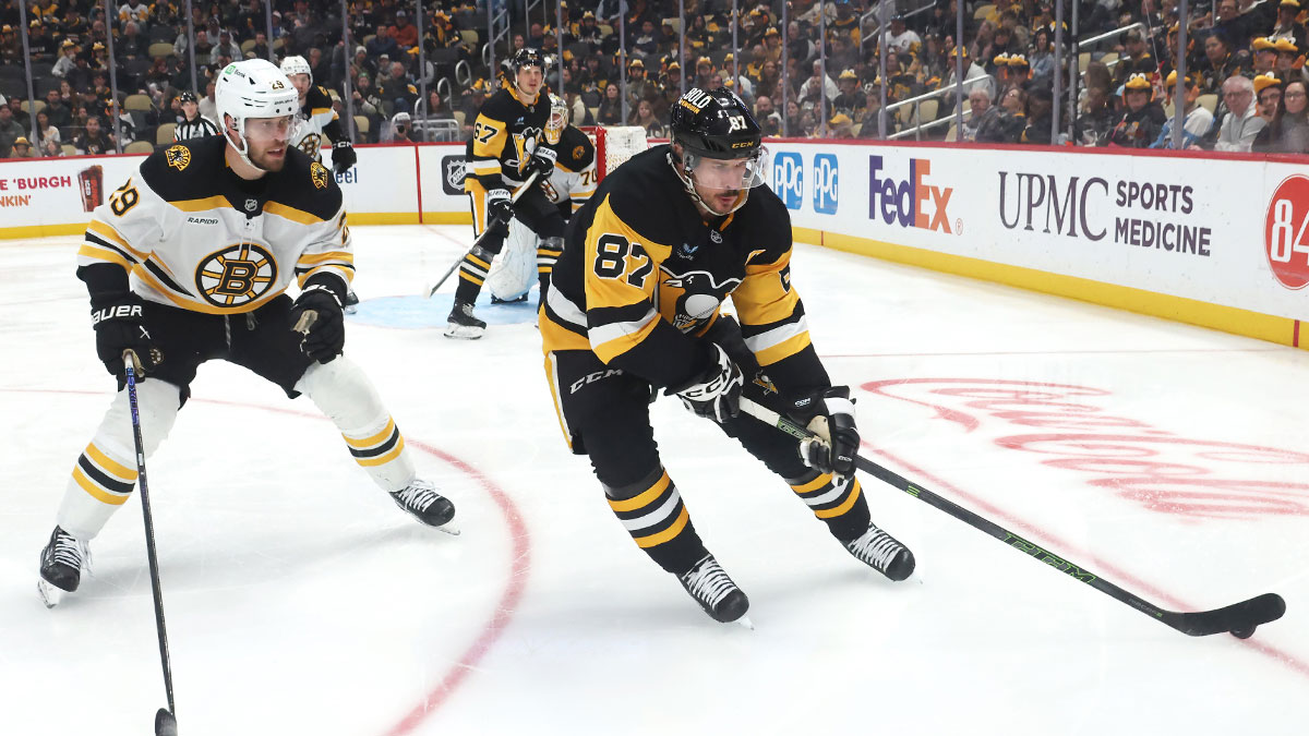 Pittsburgh Penguins center Sidney Crosby (87) skates with the puck against Boston Bruins defenseman Parker Wotherspoon (29) during the third period at PPG Paints Arena.