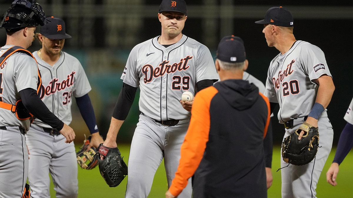 Detroit Tigers starting pitcher Tarik Skubal (29) hands the game ball to manager A.J. Hinch (center right) during the sixth inning against the Oakland Athletics at Oakland-Alameda County Coliseum.