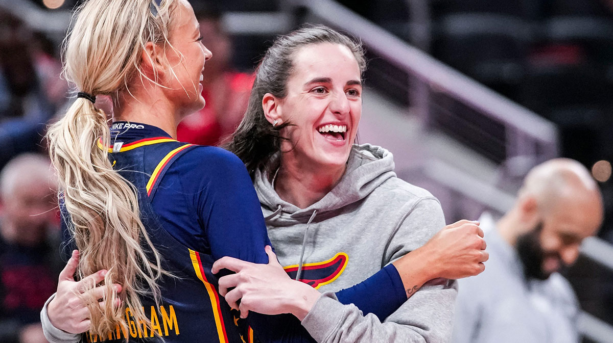 Indiana Fever Sophie Cunningham (8) hugs Indiana Fever Caitlin Clark (22) on Saturday, May 3, 2025, during a preseason game between the Indiana Fever and the Washington Mystics at Gainbridge Fieldhouse in Indianapolis. The Indiana Fever defeated the Washington Mystics in overtime, 79-74.