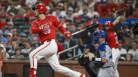 St. Louis Cardinals third baseman Nolan Arenado (28) hits a single against the Los Angeles Dodgers during the second inning at Busch Stadium.