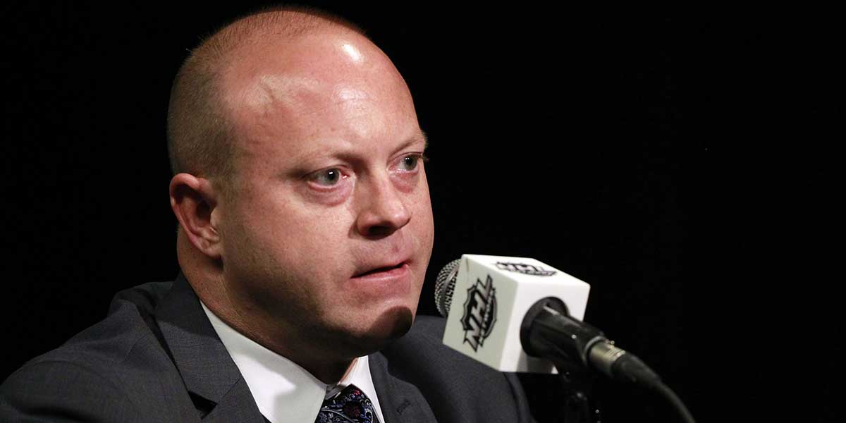 Chicago Blackhawks general manager Stan Bowman talks with media during media day the day before the 2015 Stanley Cup Final at Amalie Arena.