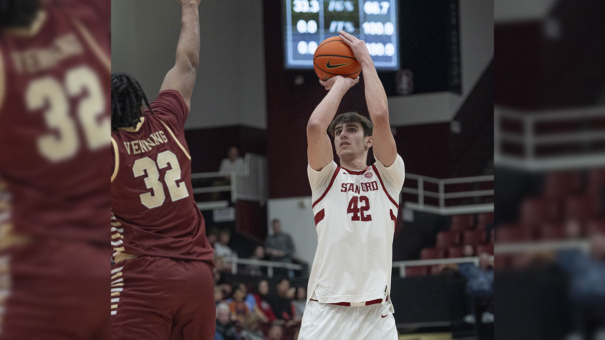 Stanford Cardinal forward Maxime Raynaud (42) shoots over Boston College Eagles forward Chad Venning (32) during the first half at Maples Pavilion.