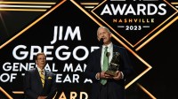 Dallas Stars general manager Jim Nill is awarded the Jim Gregory General Manager of the Year award by Nashville Predators general manager David Poile during the first round of the 2023 NHL Draft at Bridgestone Arena.