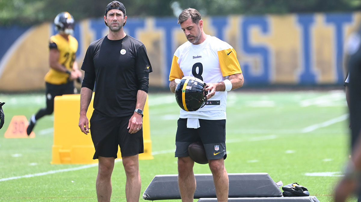 Pittsburgh Steelers quarterback Aaron Rodgers (8) puts on his helmet during minicamp at their South Side facility.