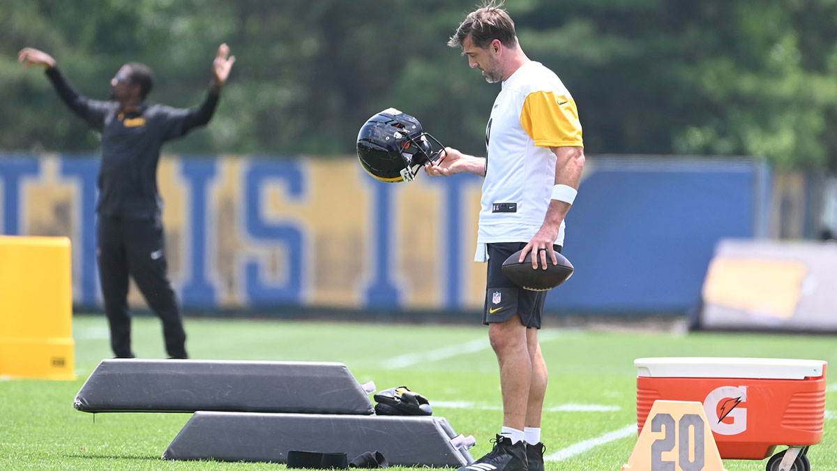Pittsburgh Steelers quarterback Aaron Rodgers (8) looks over his helmet during minicamp at their South Side facility.