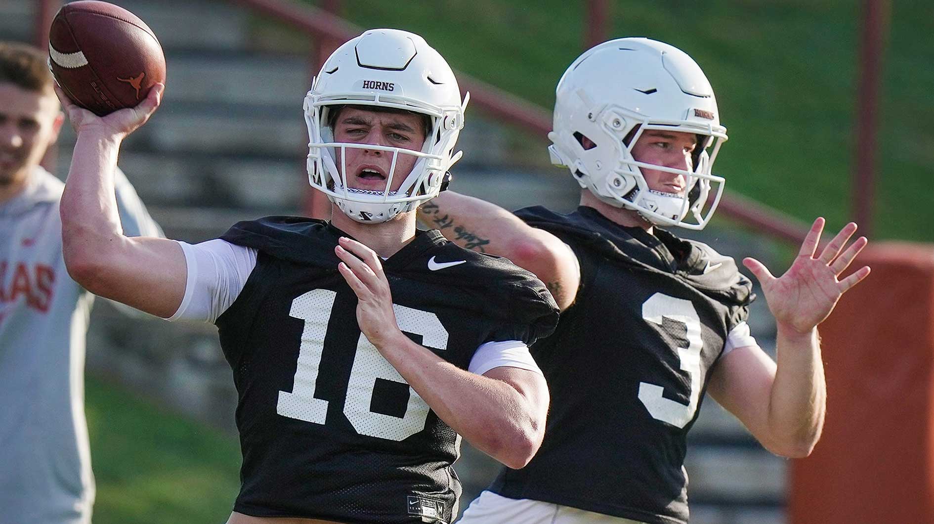 Texas Longhorns quarterbacks Arch Manning and Quinn Ewers throws the football during Texas Longhorns football spring practice at the Frank Denius practice fields in Austin Wednesday, March 8, 2023.