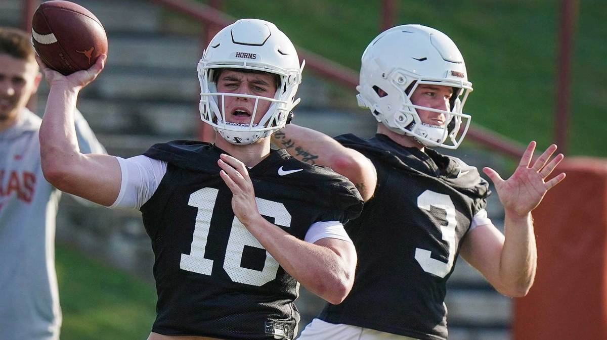 Texas Longhorns quarterbacks Arch Manning and Quinn Ewers throws the football during Texas Longhorns football spring practice at the Frank Denius practice fields in Austin Wednesday, March 8, 2023.