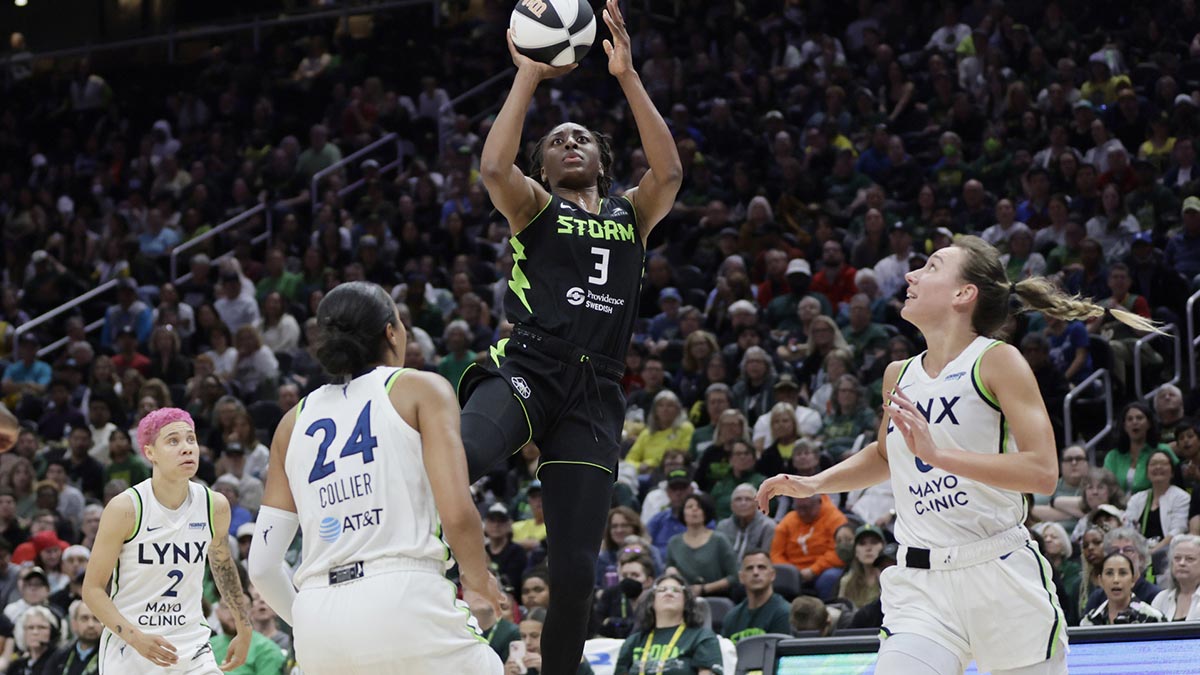 Seattle Storm forward Nneka Ogwumike (3) shoots with Minnesota Lynx guard Natisha Hiedeman (2), forward Napheesa Collier (24) and forward Alanna Smith (8) defending during the first half at Climate Pledge Arena.