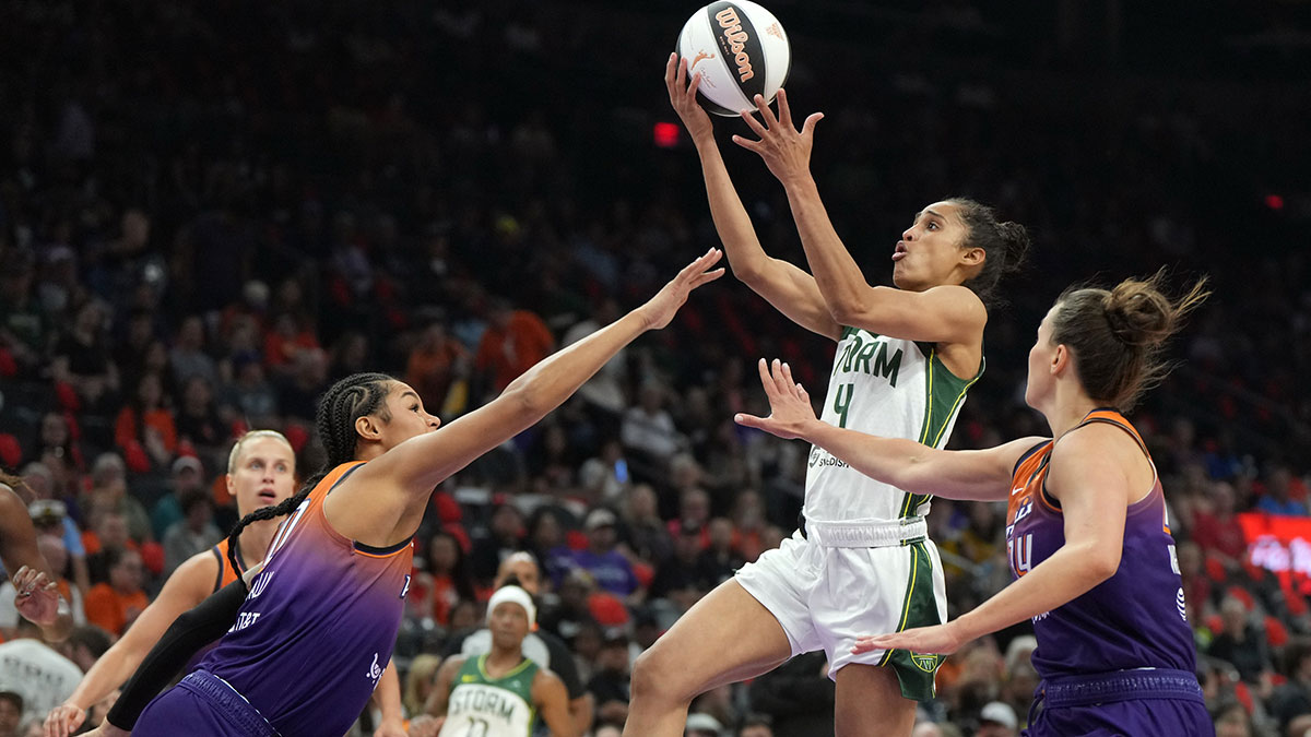 Seattle Storm guard Skylar Diggins (4) shoots over Phoenix Mercury forward Satou Sabally (0) and forward Kathryn Westbeld (24) in the first half at Footprint Center.