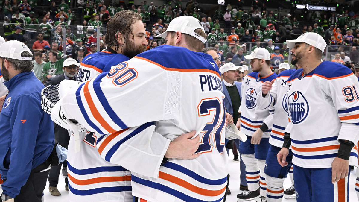 Edmonton Oilers goaltender Stuart Skinner (74) reacts with goaltender Calvin Pickard (30) after defeating the Dallas Stars in game five of the Western Conference Final of the 2025 Stanley Cup Playoffs at American Airlines Center.