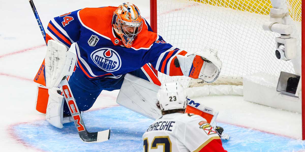 Edmonton Oilers goaltender Stuart Skinner (74) makes a save against Florida Panthers center Carter Verhaeghe (23) during the first period in game four of the 2024 Stanley Cup Final at Rogers Place.