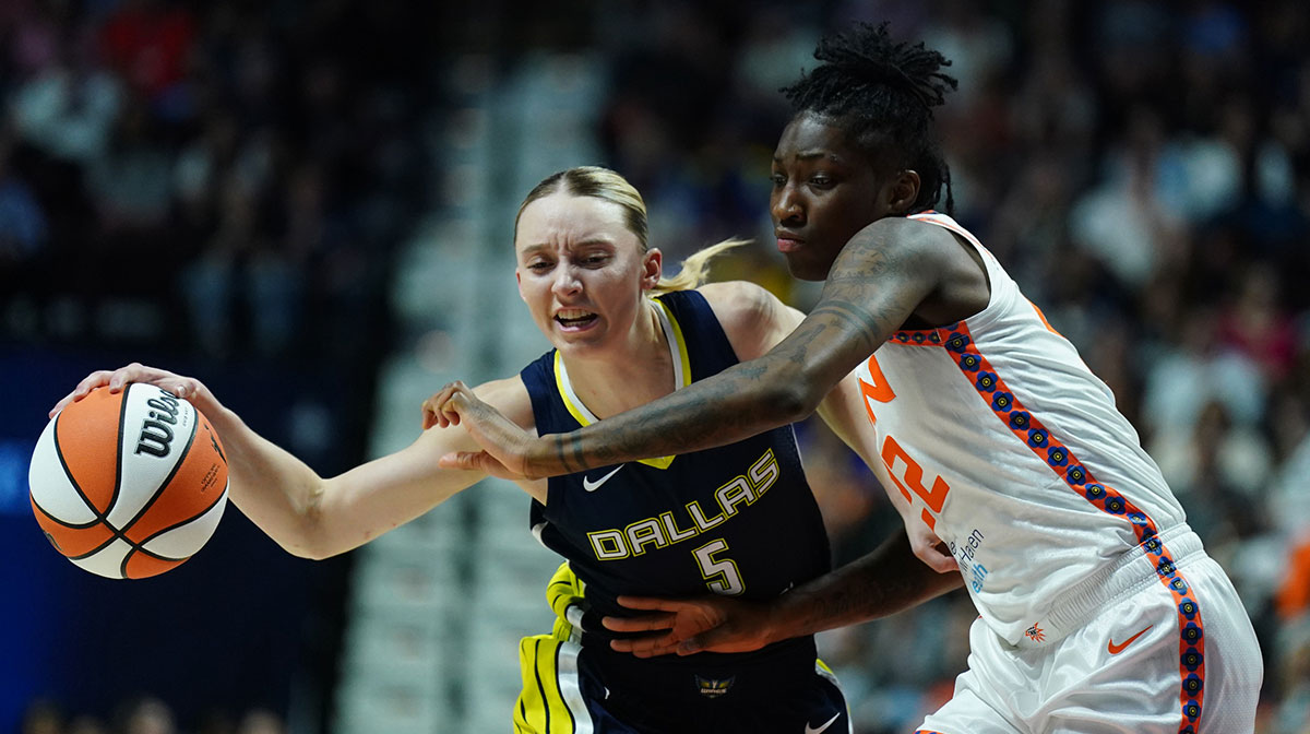 Dallas Wings guard Paige Bueckers drives the ball against Connecticut Sun guard Saniya Rivers in the first half at Mohegan Sun Arena.
