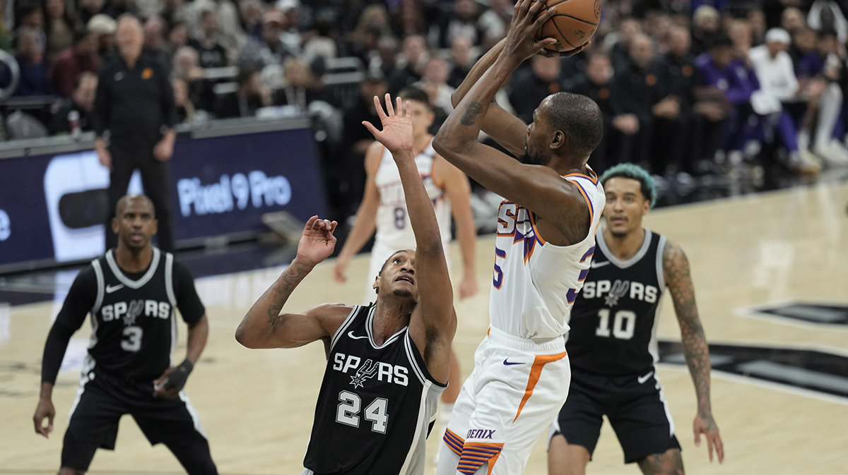 Phoenix Suns forward Kevin Durant (35) shoots over San Antonio Spurs guard Devin Vassell (24) during the first half at Moody Center.