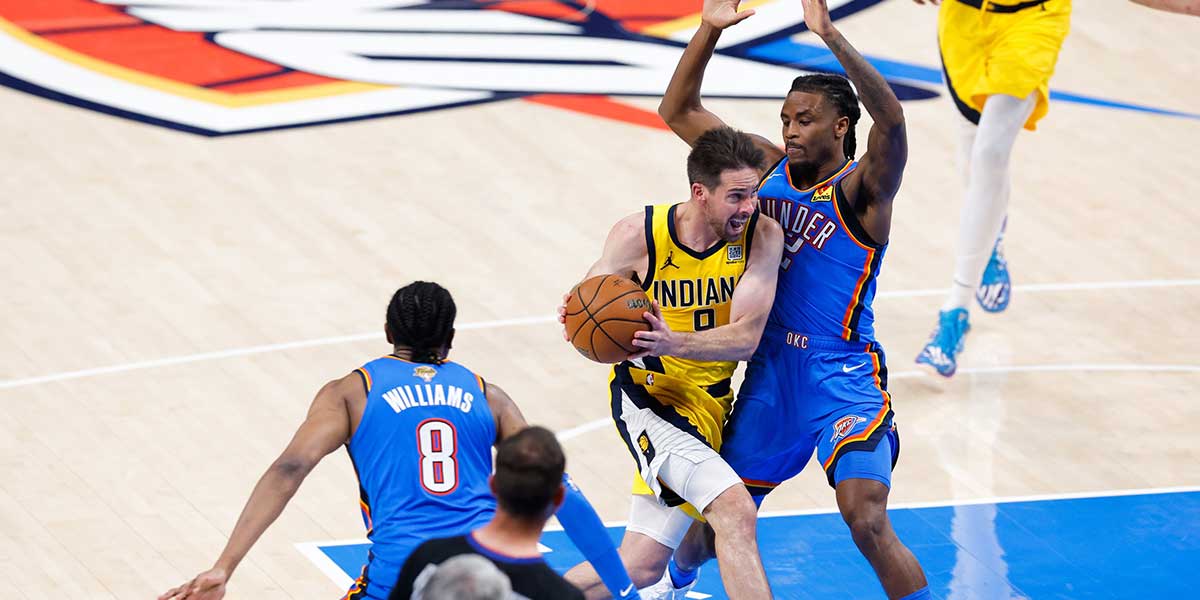 Indiana Pacers guard T.J. McConnell (9) drives to the basket as Oklahoma City Thunder guard Cason Wallace (22) defends during the second half of game seven of the 2025 NBA Finals at Paycom Center.