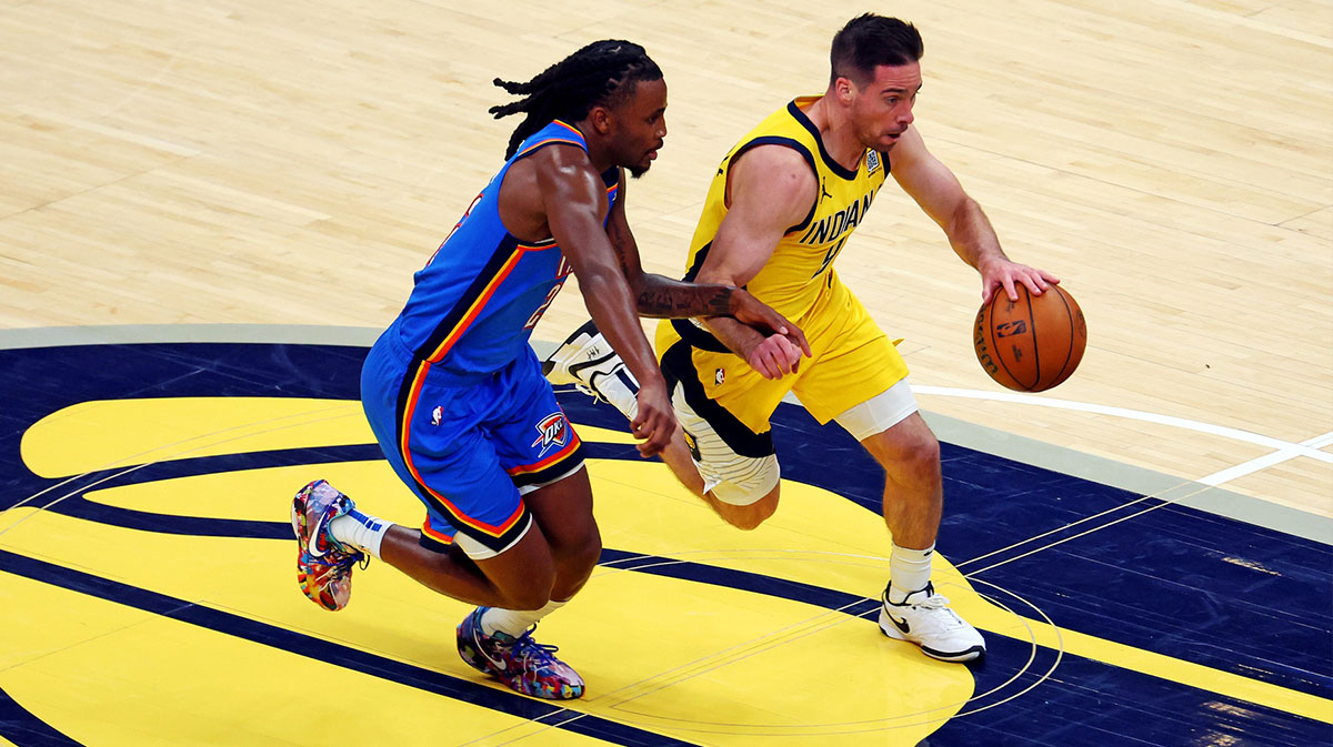 Indiana Pacers guard T.J. McConnell (9) drives to the basket against Oklahoma City Thunder guard Cason Wallace (22) during the second quarter in game three of the 2025 NBA Finals at Gainbridge Fieldhouse.