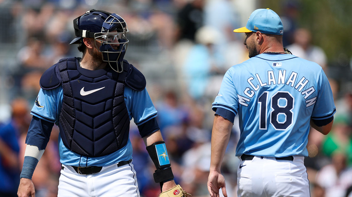 Tampa Bay Rays pitcher Shane McClanahan (18) talks to catcher Danny Jansen (19) against the New York Mets in the first inning during spring training at Charlotte Sports Park. Caballero