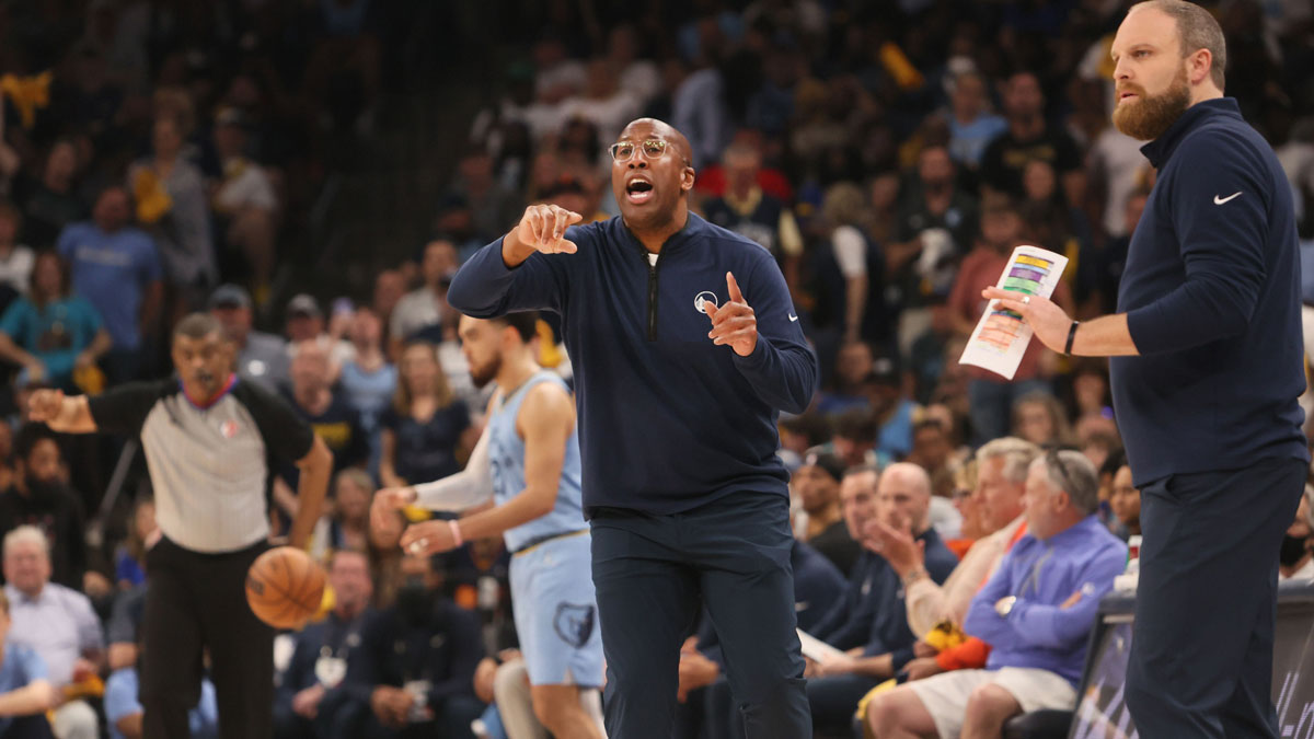 May 11, 2022; Memphis, Tennessee, USA; Memphis Grizzlies Head Coach Taylor Jenkins (right) and Interim Golden State Warriors Head Coach Mike Brown (left) lead their teams from the sidelines during game five of the second round for the 2022 NBA playoffs at FedExForum. Mandatory Credit: Joe Rondone-Imagn Images
