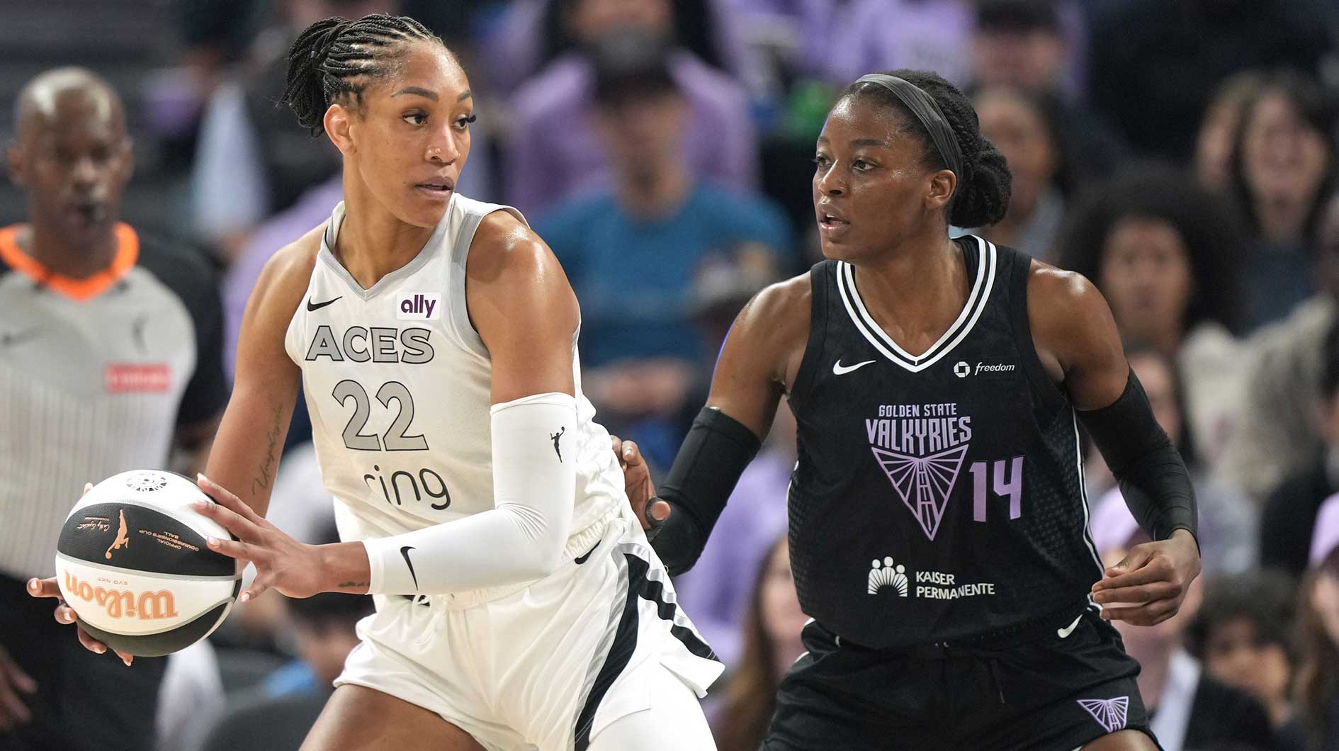 Las Vegas Aces center A'ja Wilson (22) handles the ball against Golden State Valkyries center Temi Fagbenle (14) during the first quarter at Chase Center.
