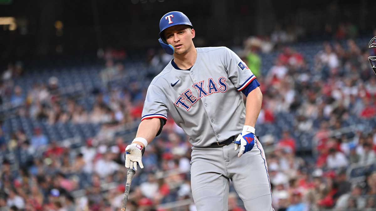 Texas Rangers shortstop Corey Seager (5) tosses his bat after drawing a walk during the fifth inning against the Washington Nationals at Nationals Park.