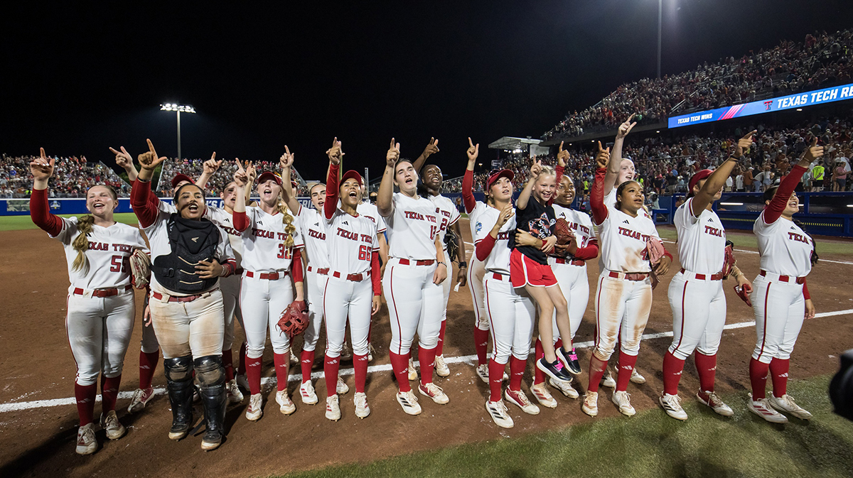 Jun 5, 2025; Oklahoma City, OK, USA; Texas Tech Red Raiders players cheer towards the fans after defeating the Texas Longhorns in the NCAA Softball Women's College World Series finals at Devon Park. Mandatory Credit: Brett Rojo-Imagn Images