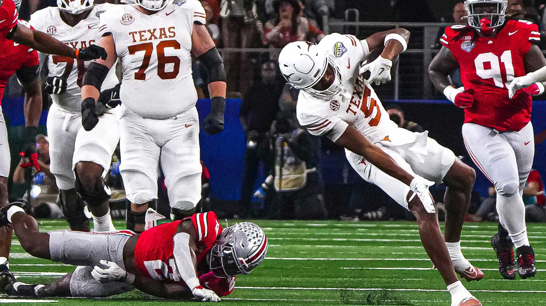 Texas Longhorns receiver Ryan Wingo (5) slips after a catch during the College Football Playoff semifinal game against Ohio State in the Cotton Bowl at AT&T Stadium on Friday, Jan. 10, 2024 in Arlington, Texas.