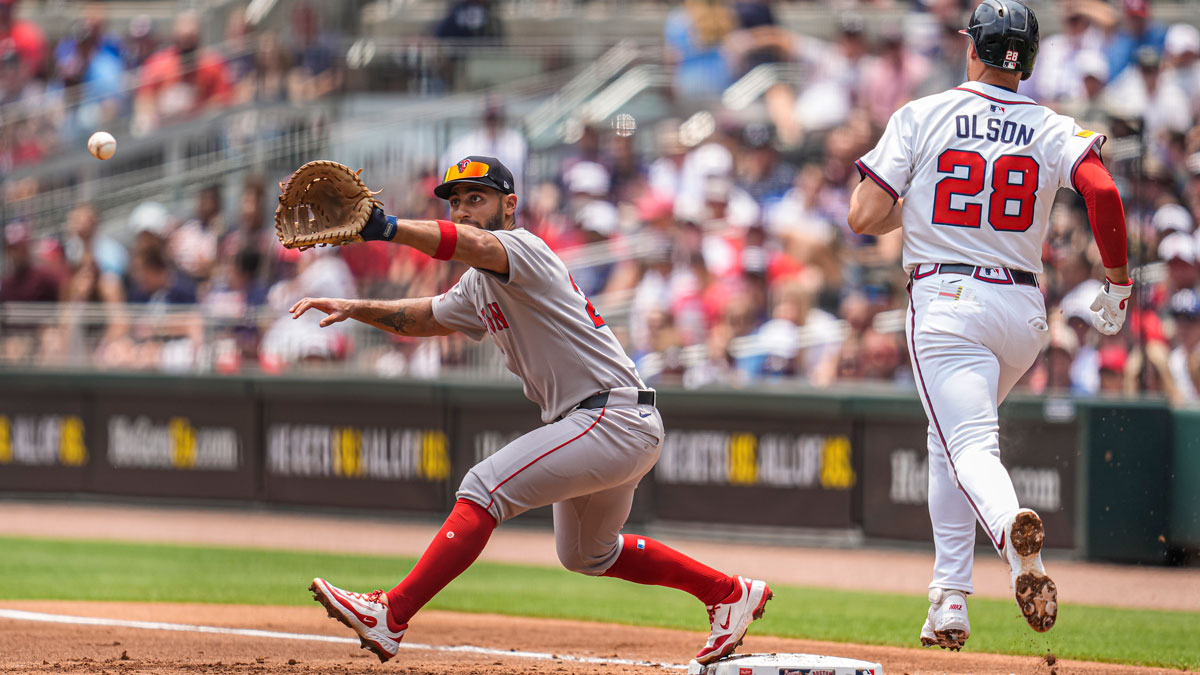 Boston Red Sox first baseman Abraham Toro (29) retires Atlanta Braves first baseman Matt Olson (28) at first base during the first inning at Truist Park.