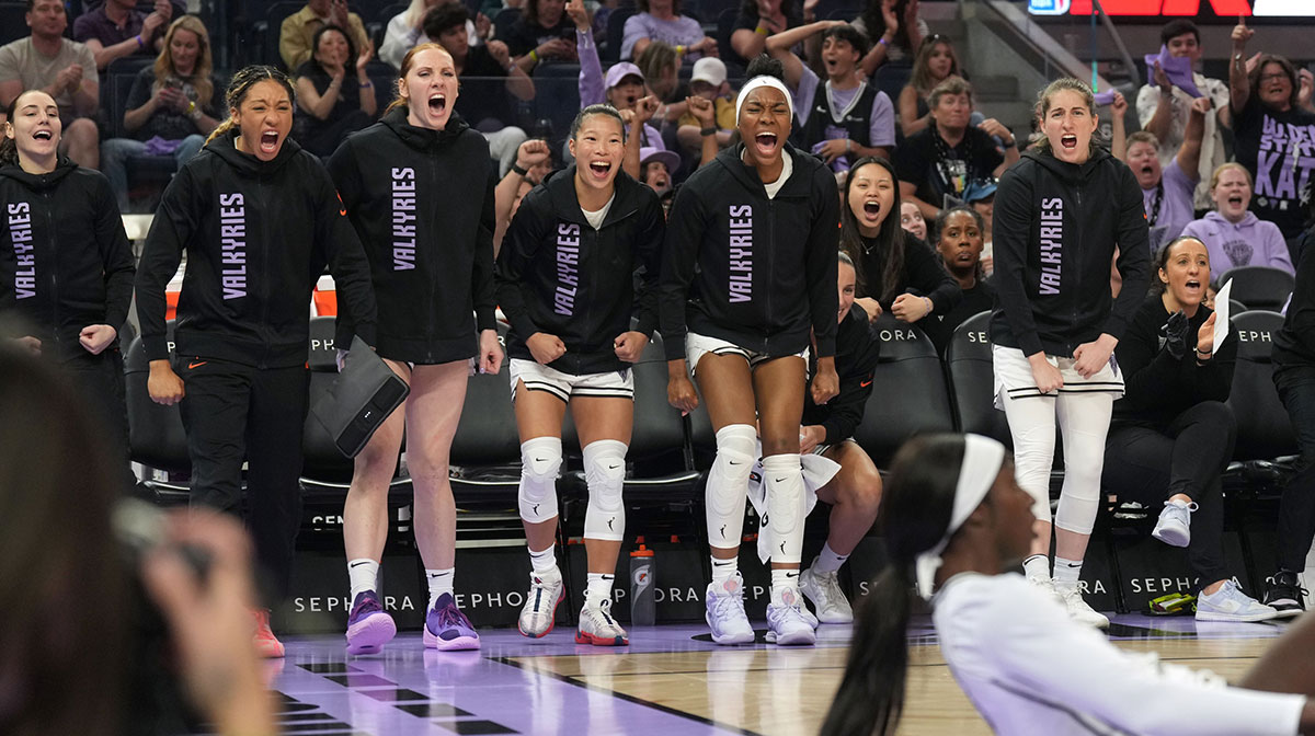 The Golden State Valkyries bench reacts after a basket by forward Laeticia Amihere (foreground right) against the Connecticut Sun during the first quarter at Chase Center.