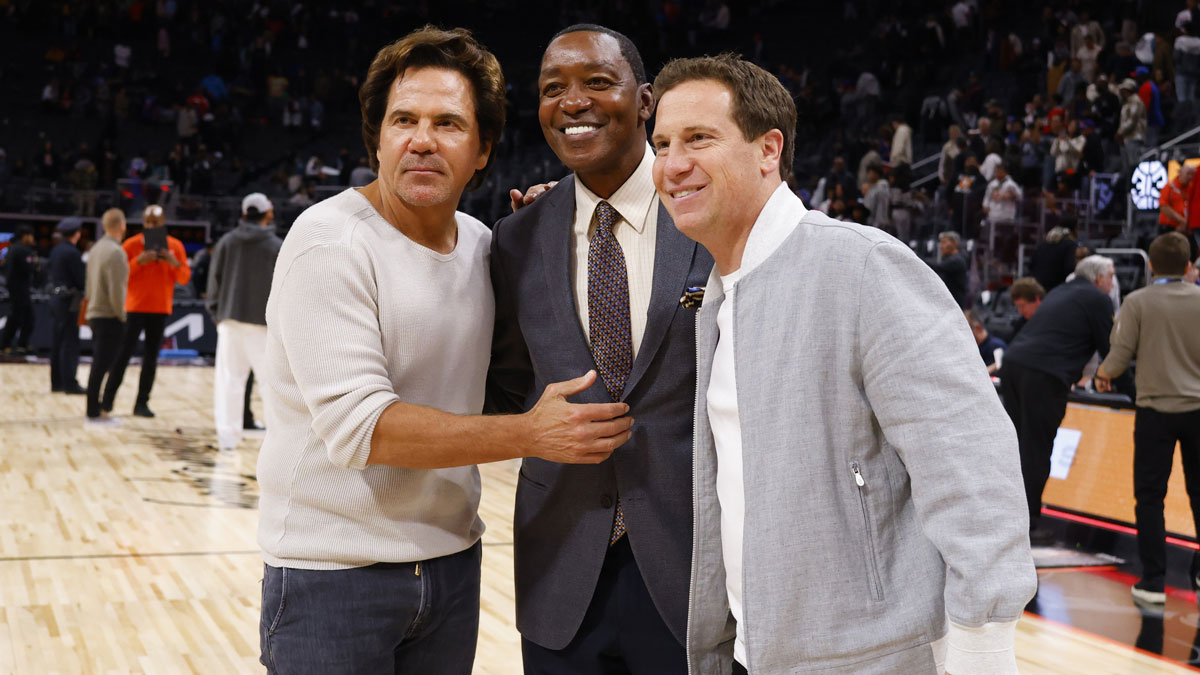 Detroit Pistons owner Tom Gores (left) former Detroit Pistons Isiah Thomas and Phoenix Suns owner Mat Ishbia pose after the game at Little Caesars Arena.