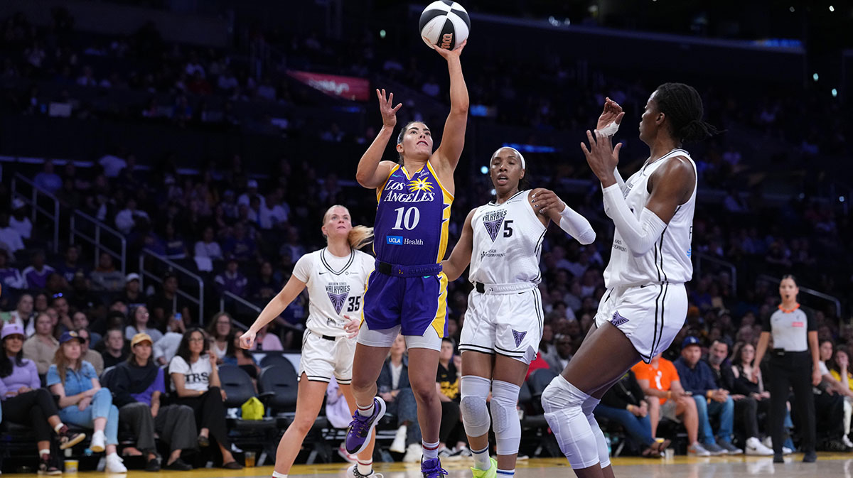 LA Sparks guard Kelsey Plum (10) shoots the ball against Golden State Valkyries guard Julie Vanloo (35), forward Kayla Thornton (5) and center Temi Fagbenle (14) in the first half at Crypto.com Arena.