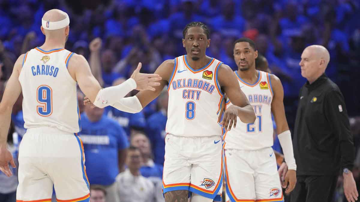 Thunder guard Alex Caruso (9) high fives guard Alex Caruso (9) during the second quarter of game five of the 2025 NBA Finals at Paycom Center