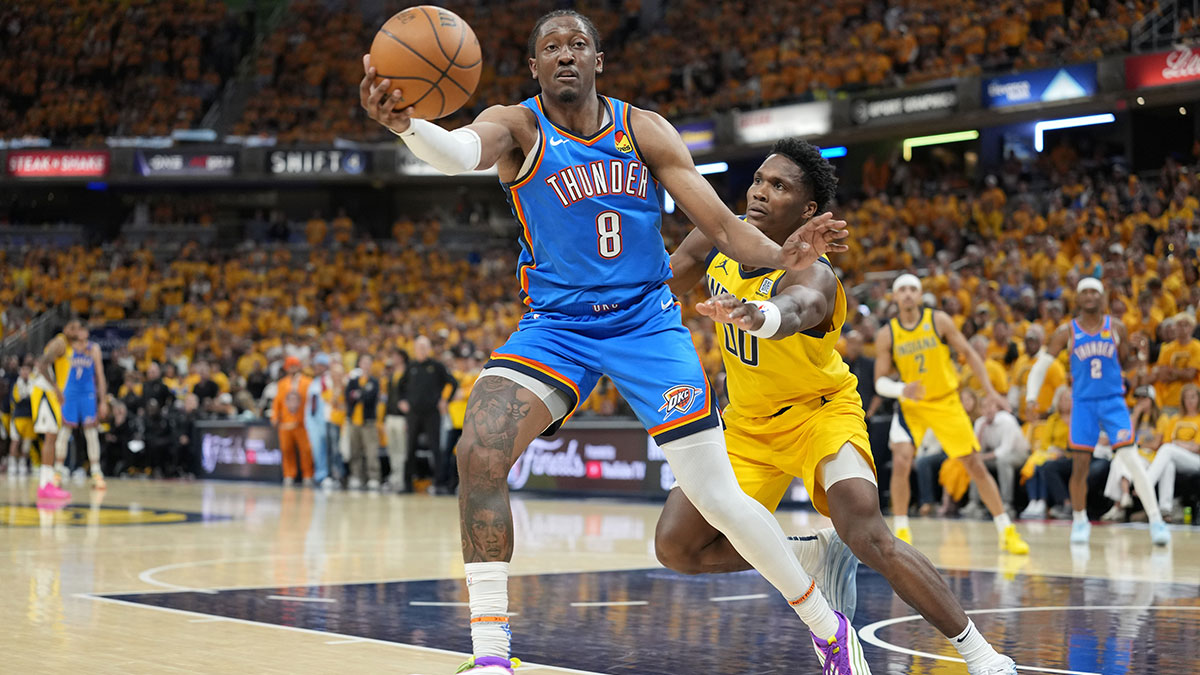 Thunder forward Jalen Williams (8) controls the ball against Indiana Pacers guard Bennedict Mathurin (00) during the second half during game four of the 2025 NBA Finals at Gainbridge Fieldhouse with Thunder head coach Mark Daigneault in the background
