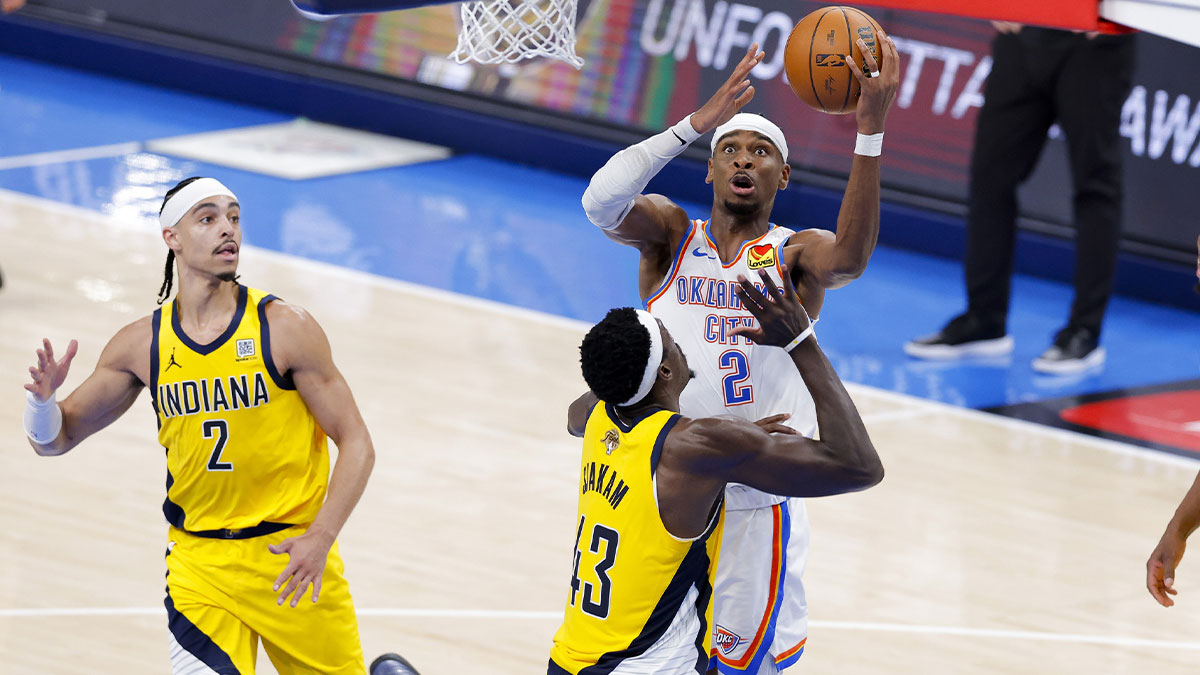 Thunder guard Shai Gilgeous-Alexander (2) drives to the basket past Indiana Pacers forward Pascal Siakam (43) during the fourth quarter during game one of the 2025 NBA Finals at Paycom Center