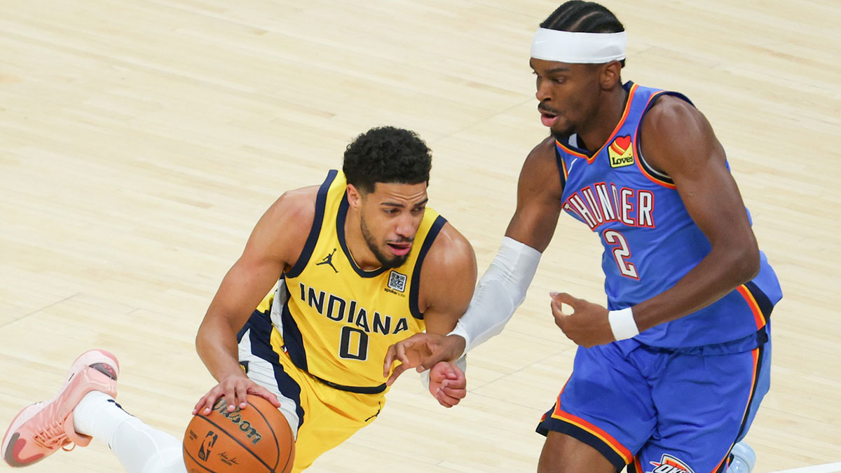 Pacers guard Tyrese Haliburton (0) drives to the basket against Oklahoma City Thunder guard Shai Gilgeous-Alexander (2) in the first quarter during game six of the 2025 NBA Finals at Gainbridge Fieldhouse